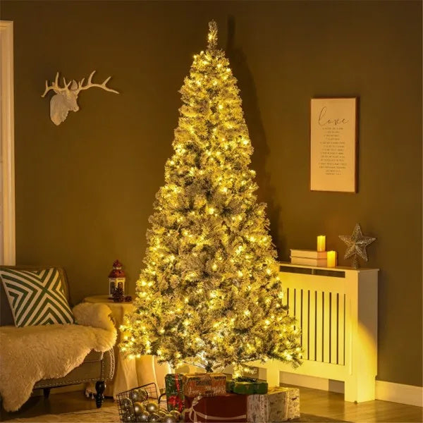 Blitzen Christmas Tree – 7.5ft tall snow-flocked artificial tree with 500 warm white LED lights, lush wide leaves, and flame retardant branches – Christmas Mercantile