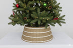 Noelle coastal tree collar – sturdy iron frame wrapped in organic seagrass and white stripes, replacing traditional tree skirts with modern bohemian flair – Christmas Mercantile